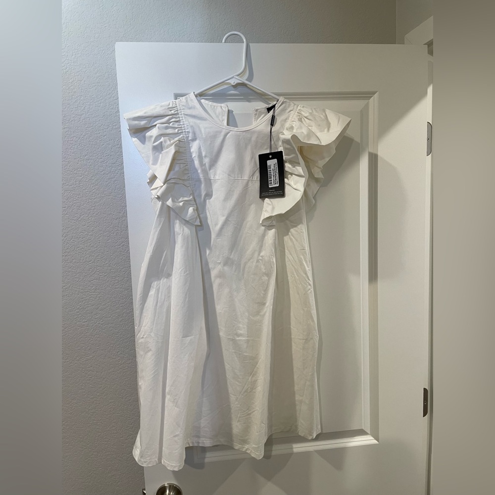 Woman’s White Smock Dress in size 6 from PrettyLittle thing.